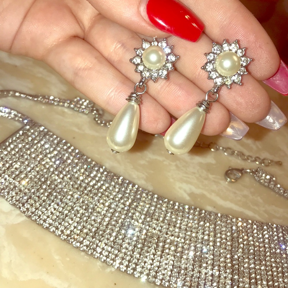 a pearl and rhinestone set .